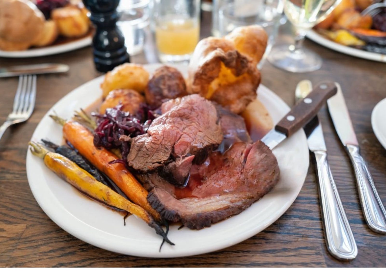 A Sunday roast with crispy potatoes, vegetables and gravy