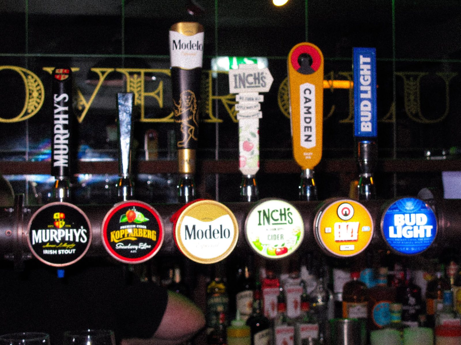 The bank of draught taps and spirit shelves behind the bar